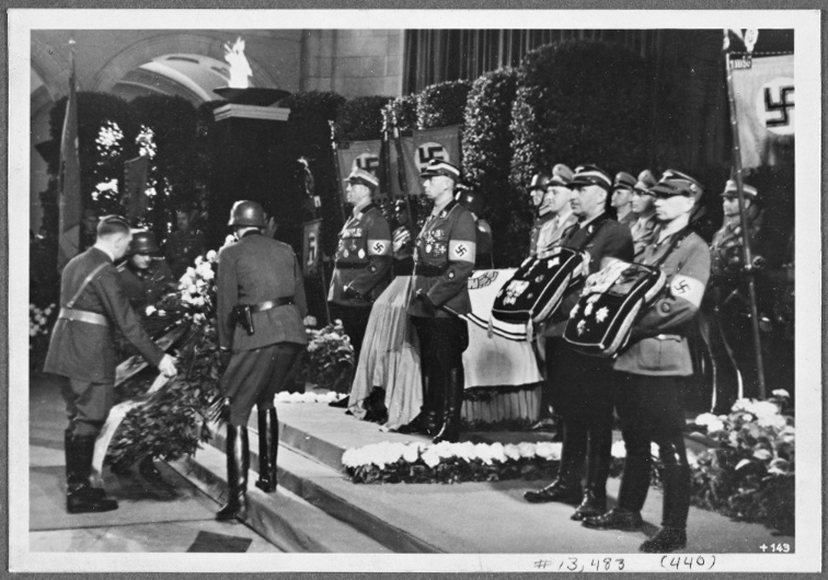 Adolf Hitler lays a wreath at the funeral of NSKK leader Adolf Huenlein